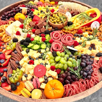 Extra-large charcuterie platter in Glendora, CA with artisan meats, cheeses, olives, fresh fruit, pretzels, and macarons by Rose Gold Charcuterie.